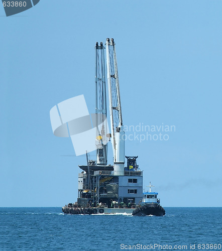 Image of Tugboat and floating cranes