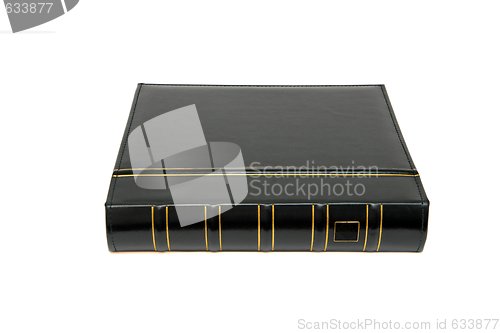 Image of Thick black book laid isolated