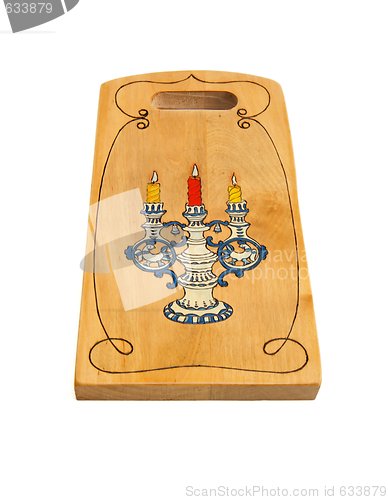 Image of Wooden cutting board painted with candlestick isolated