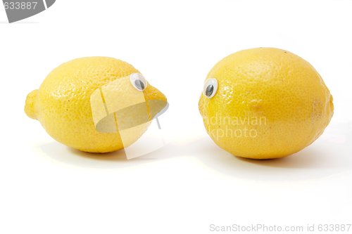 Image of Two funny lemon fruits with eyes isolated
