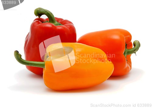 Image of Three sweet bell peppers of different colors isolated
