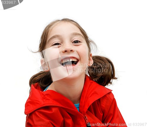 Image of Laughing seven years girl with pigtails isolated