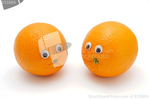 Image of Two funny orange fruits with eyes isolated