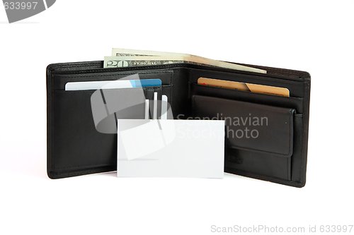 Image of White business card in front of black wallet isolated