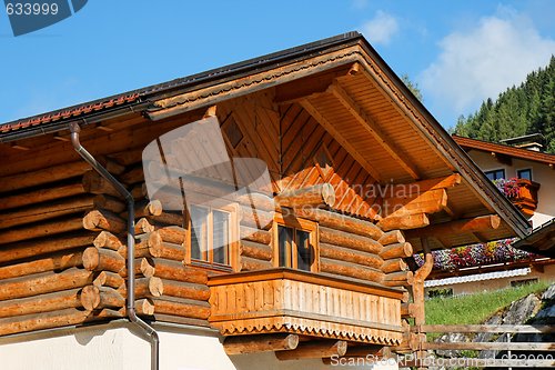 Image of Wooden Alpine chalet with a balcony