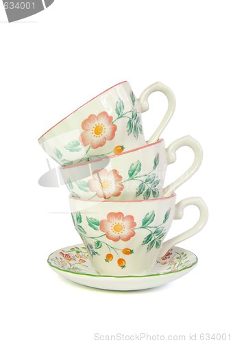 Image of Stack of three porcelain tea cups isolated 