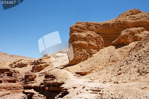 Image of Red eroded rocks in stony desert