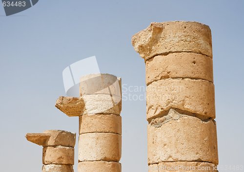 Image of Three broken column tops of ancient temple