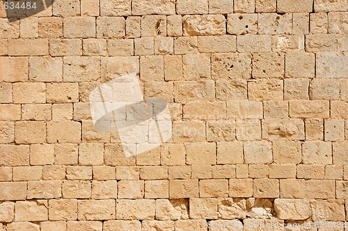 Image of Ancient golden stone block wall texture