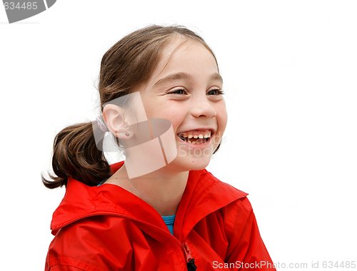 Image of Laughing seven years girl with pigtails isolated