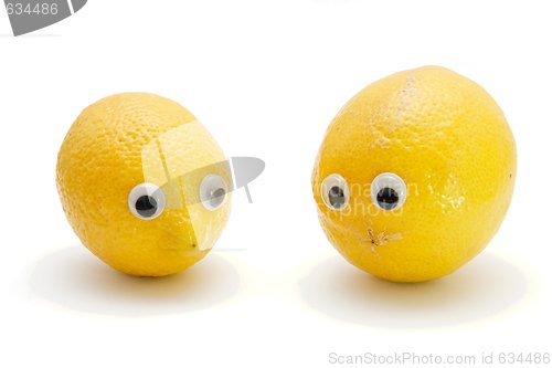 Image of Two funny lemon fruits with eyes