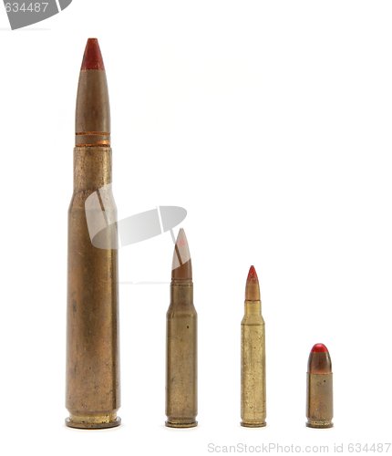 Image of Four red-tipped tracer cartridges of various calibers isolated