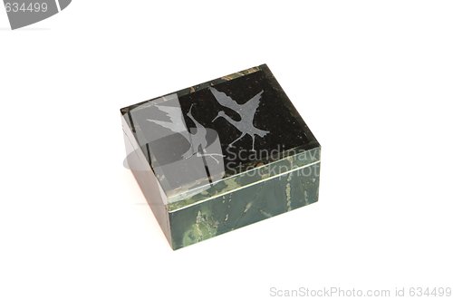 Image of Stone casket engraved with dancing cranes isolated