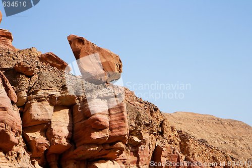 Image of Picturesque unstable red rock in stone desert