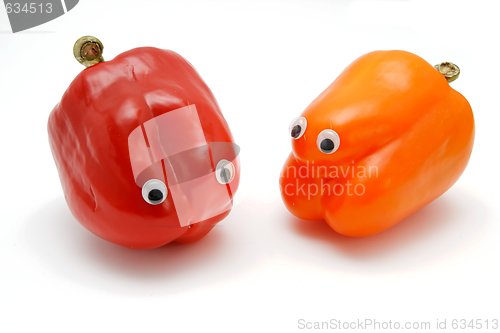 Image of Two sweet bell peppers with eyes isolated