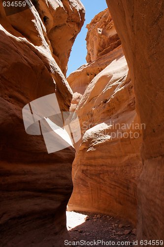 Image of Narrow slot between two orange rocks desert canyon