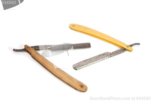 Image of Two vintage  rusty razors isolated