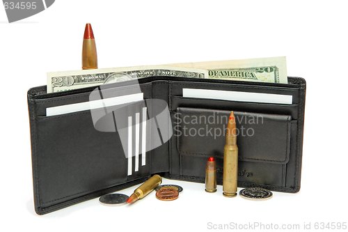 Image of Black wallet, money and cartridges  isolated