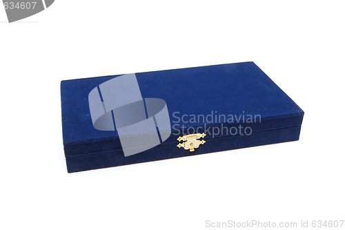 Image of Closed dark blue velvet casket with golden lock isolated
