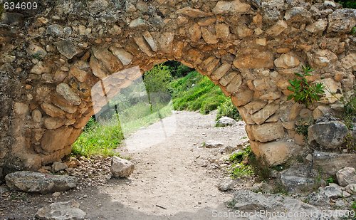 Image of Ancient stone arch on the hiking trail outdoor