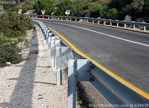 Image of Road with guardrail closeup in perspective