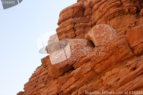 Image of Erosion reliefs on red sandstone rocks in desert