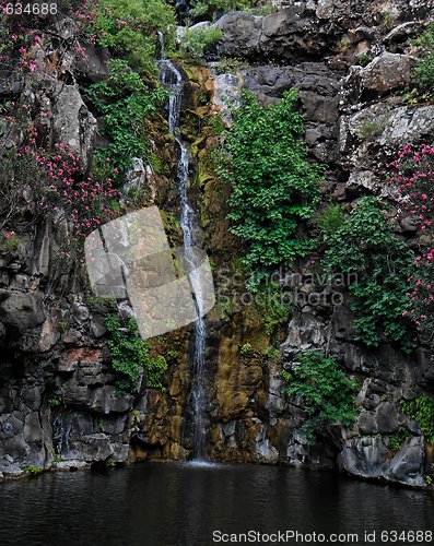 Image of Waterfall falls on black basalt rocks