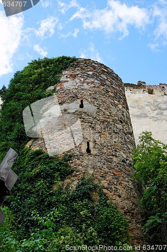 Image of Round tower of medieval castle upward view
