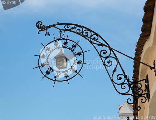 Image of Iron shop sign in shape of lantern and star