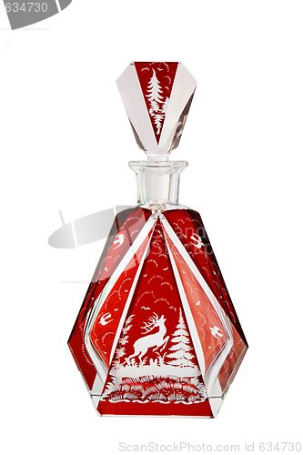 Image of Red crystal carafe with cut prancing deer isolated