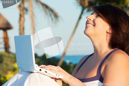 Image of lovely woman with laptop computer