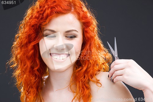 Image of redhead with scissors