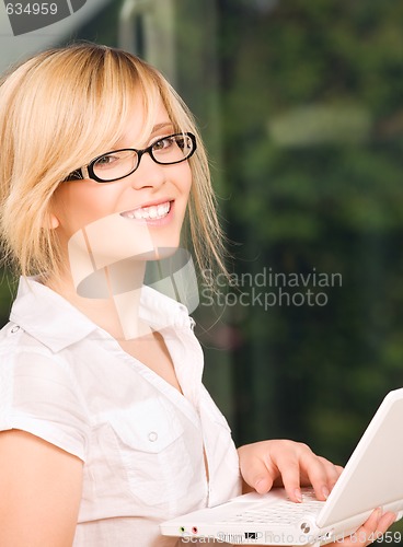 Image of office girl with laptop computer