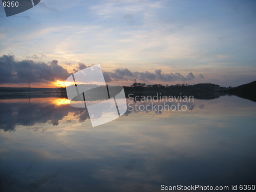 Image of Mystic sunset over still water