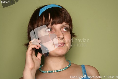 Image of young woman calling by cellular phone