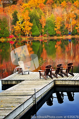 Image of Wooden dock on autumn lake