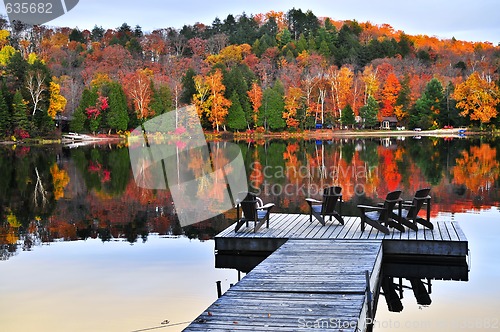 Image of Wooden dock on autumn lake