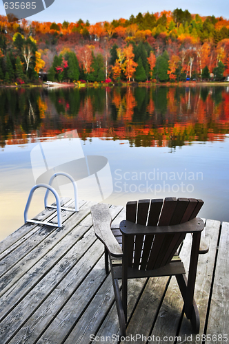 Image of Wooden dock on autumn lake