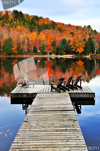 Image of Wooden dock on autumn lake