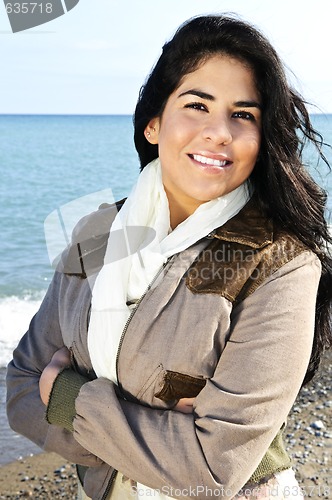 Image of Beautiful young woman at beach