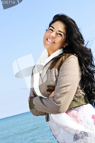 Image of Beautiful young woman at beach