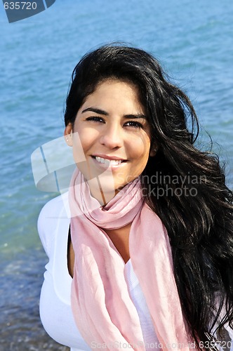 Image of Beautiful young woman at beach