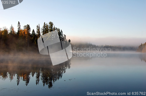 Image of An autumn's landscape with fog