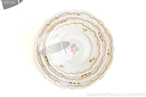 Image of Stack of three white plates and saucers top view isolated