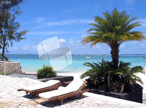 Image of By the pool facing the ocean at a resort