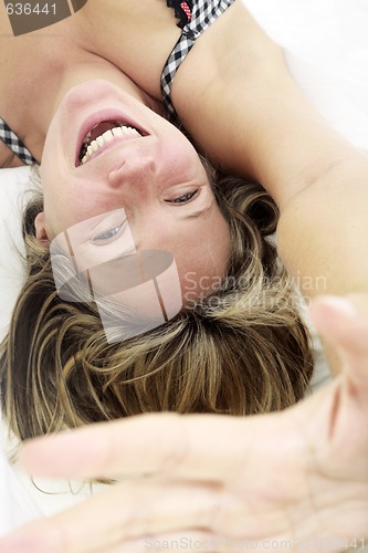 Image of Playful Woman in Bed