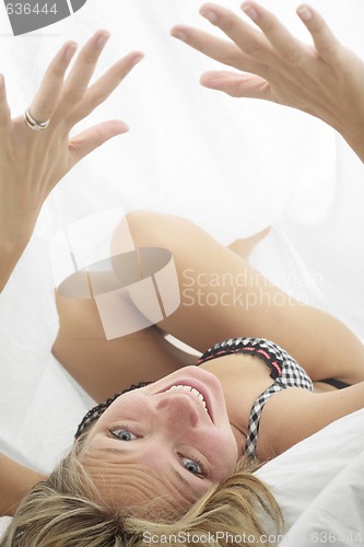 Image of Playful Woman in Bed