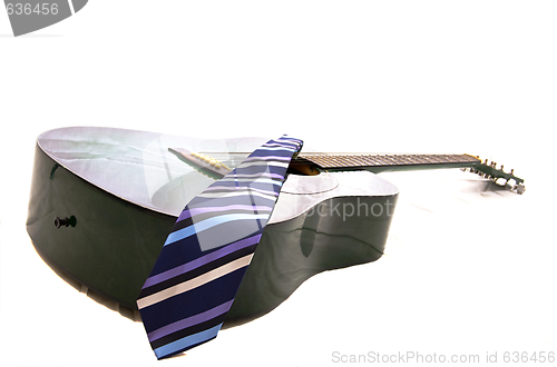 Image of Acoustic guitar and business tie