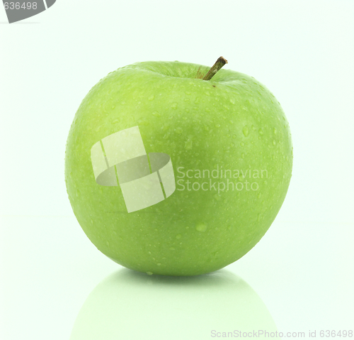 Image of A fresh green apple with water drops