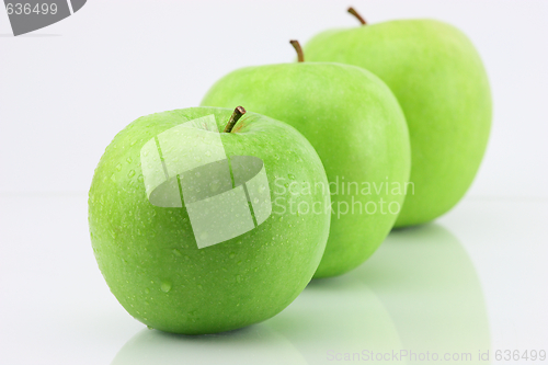 Image of three apple isolated on white